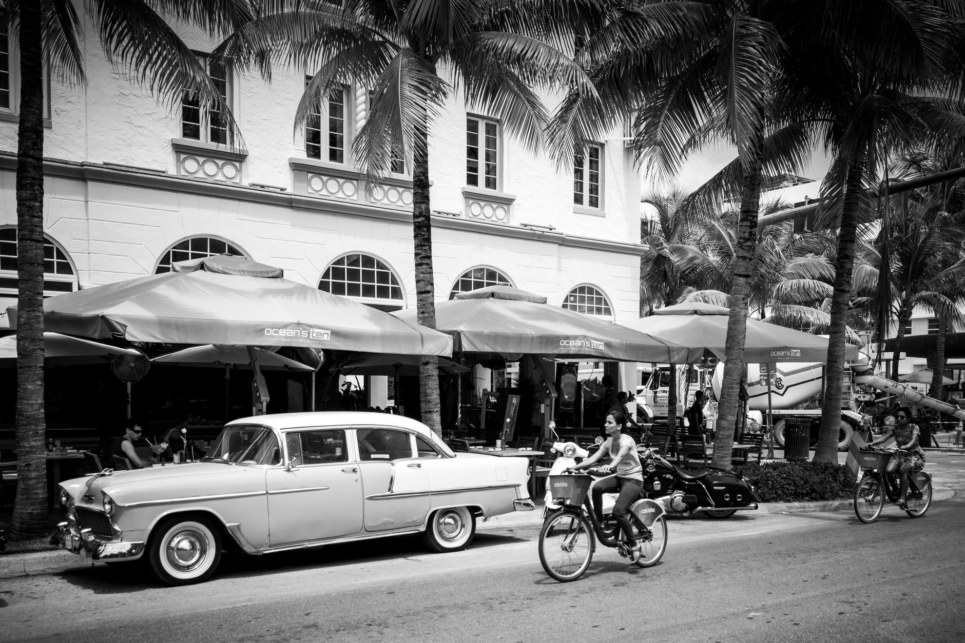 Cyclists riding along a scenic coastal path in Palm Beach