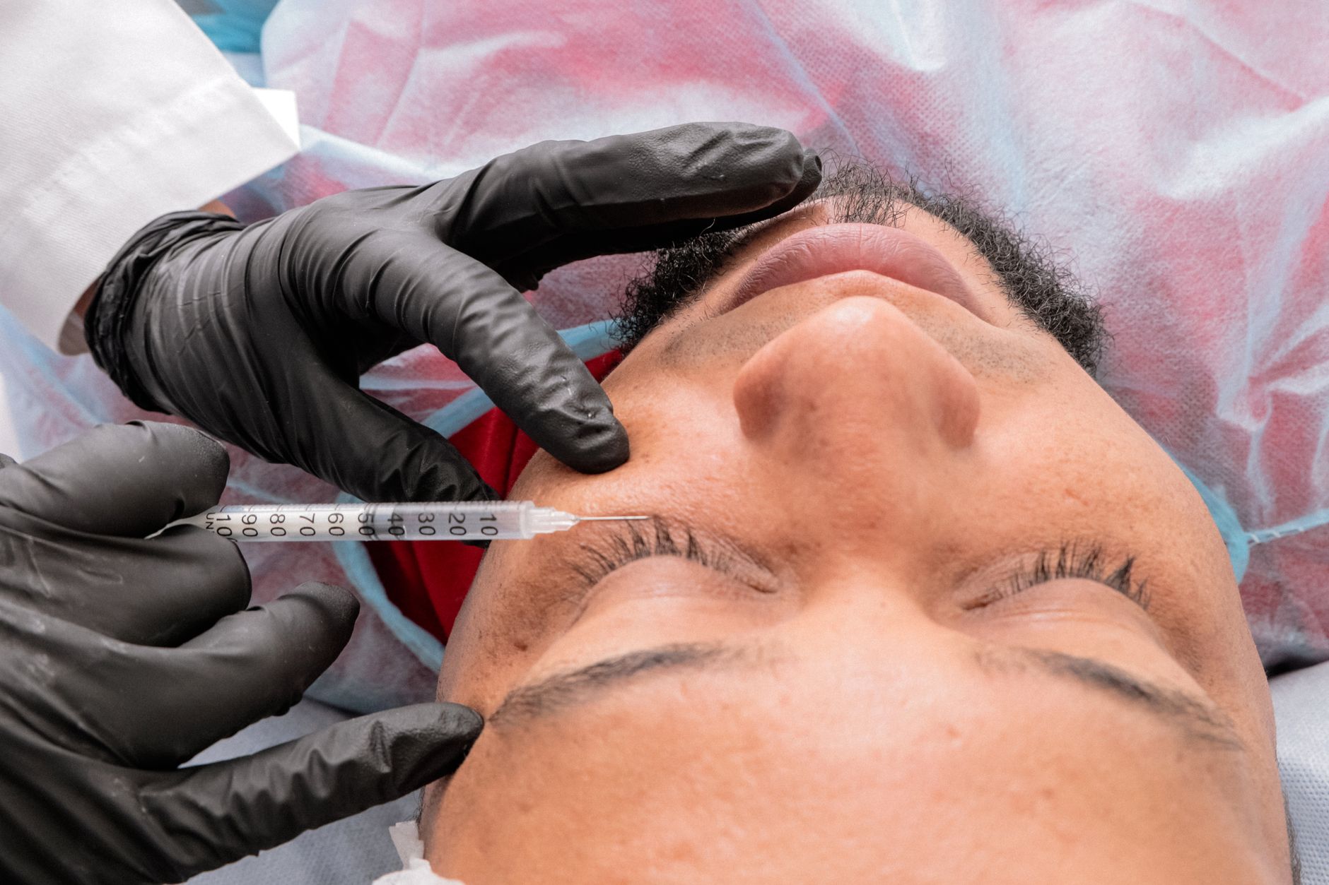 Aesthetician applying a facial treatment at a spa